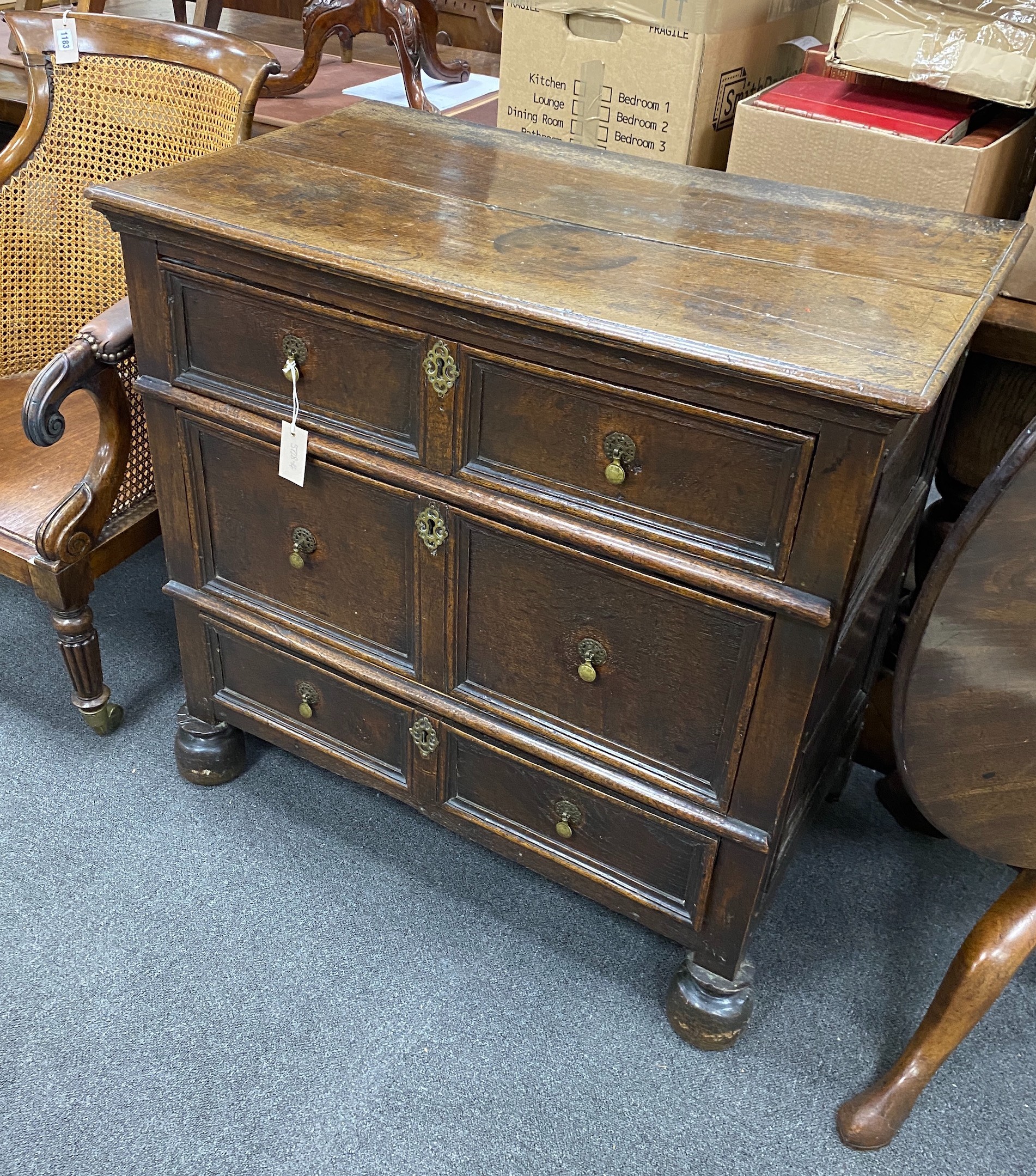 An 18th century oak chest of three drawers, width 91cm, depth 53cm, height 87cm